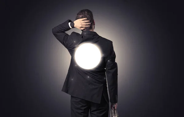 Businessman standing with maze on his back — Stock Photo, Image