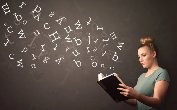 Young lady holding book with letters — Stock Photo, Image