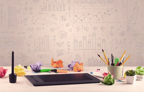 Graph charts and designer office desk — Stock Photo, Image