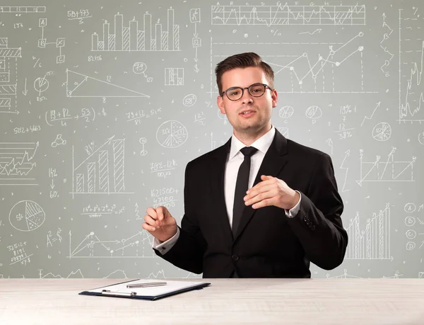 Businessman sitting at a desk — Stock Photo, Image