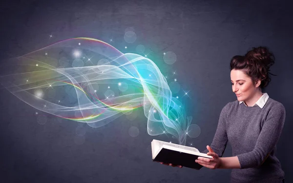Young lady holding book with waves — Stock Photo, Image