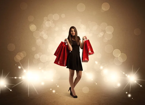Shopping Lady mit Taschen im hellen Licht — Stockfoto