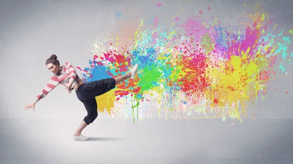 Young colorful street dancer with paint splash — Stock Photo, Image