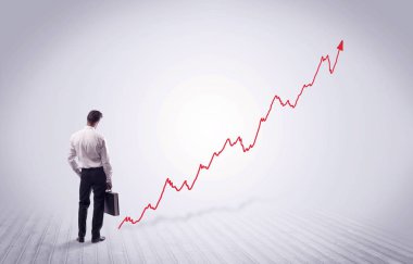 Kırmızı grafik ok ile ayakta işadamı