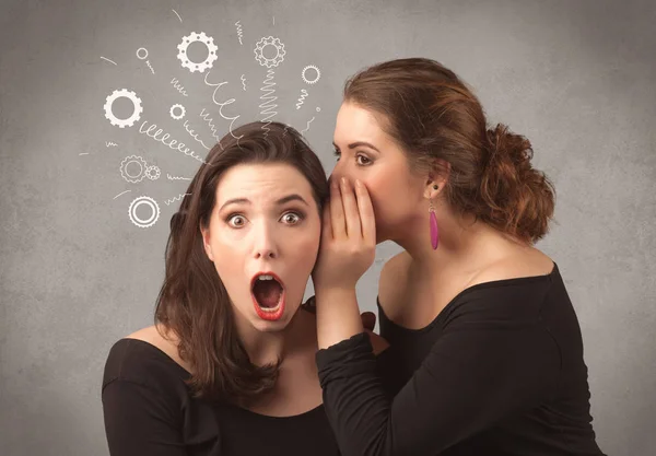 Girl telling secret things to her girlfriend — Stock Photo, Image