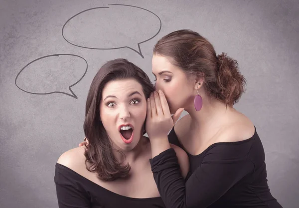 Girl telling secret things to her girlfriend — Stock Photo, Image