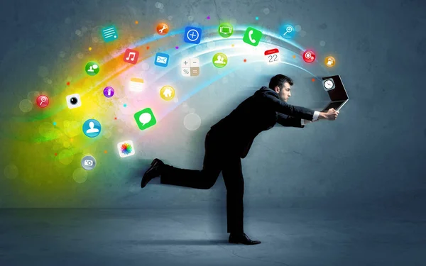 Running businessman with application icons from device — Stock Photo, Image