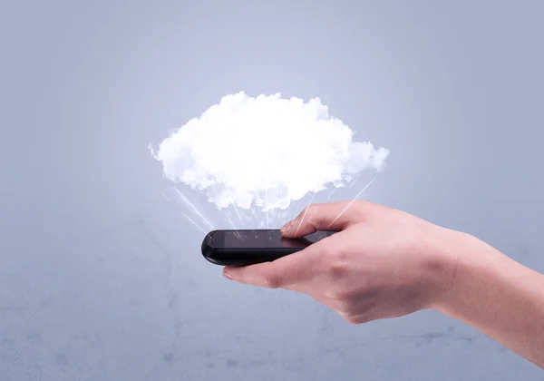 Hand holding phone with empty cloud — Stock Photo, Image