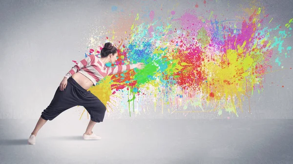 Young colorful street dancer with paint splash — Stock Photo, Image