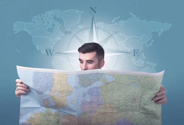 Young man holding map — Stock Photo, Image