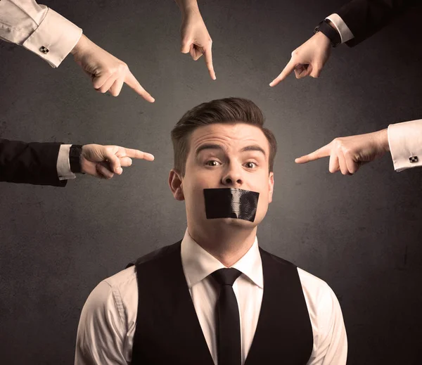 Multiple hands pointing at business employee — Stock Photo, Image