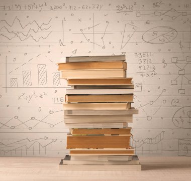 Karalama stilinde yazılmış matematik formülleri olan bir yığın kitap.