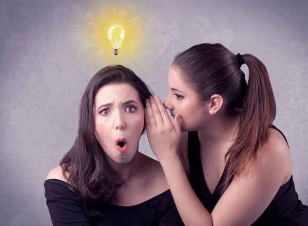 Girl telling secret things to her girlfriend — Stock Photo, Image