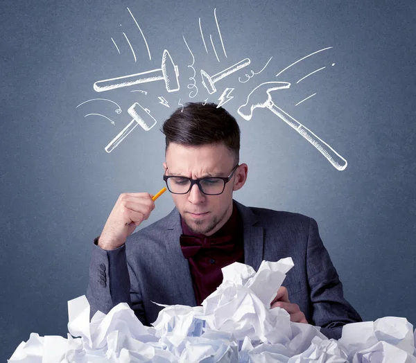 Businessman above crumpled paper — Stock Photo, Image