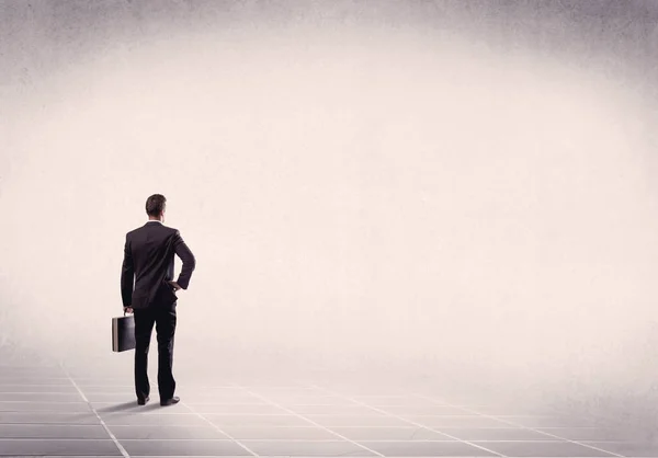 Business person standing in empty space — Stock Photo, Image