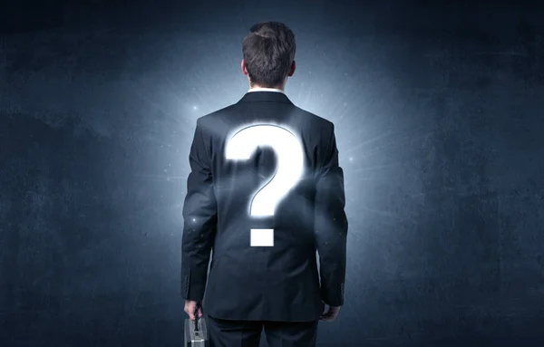 Man standing with question mark on his back — Stock Photo, Image