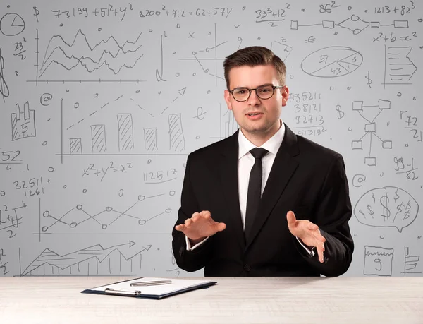 Businessman sitting at a desk — Stock Photo, Image