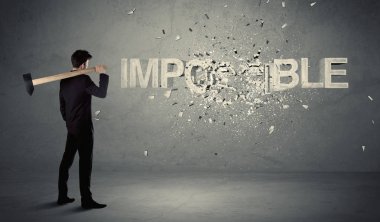 Business man hitting impossible sign with hammer clipart