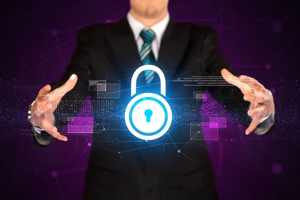 Businessman holding lock graphic — Stock Photo, Image