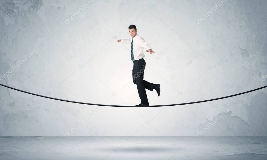 Sales guy balancing on tight rope