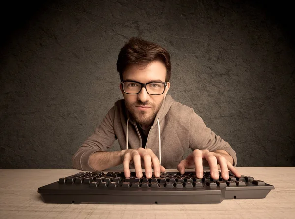 Computer geek typing on keyboard — Stock Photo, Image