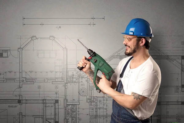 Worker with technical drawing.