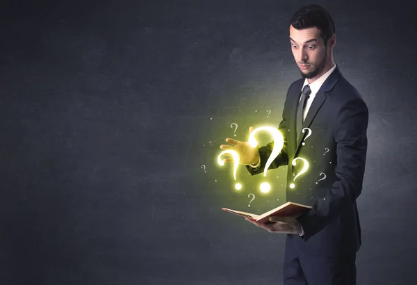 Businessman looking in a book. — Stock Photo, Image