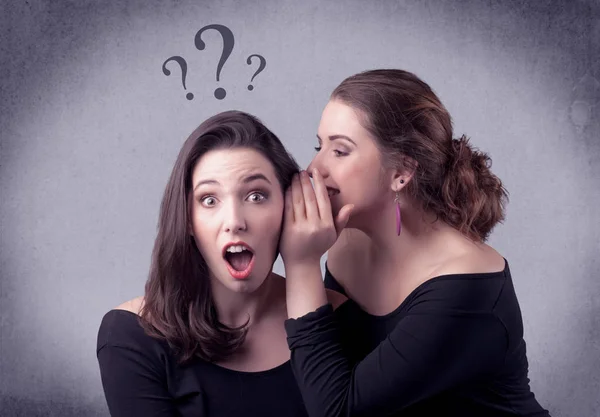 Girl telling secret things to her girlfriend — Stock Photo, Image