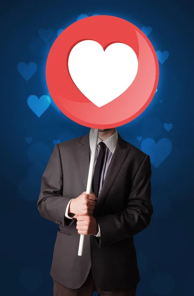Podnikatel, drží srdce znamení — Stock fotografie