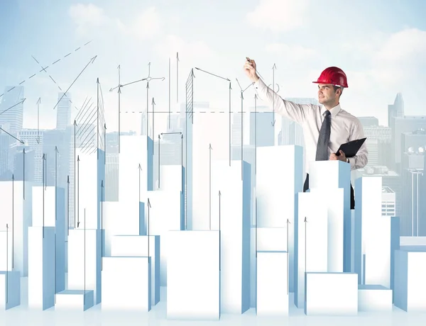 Businessman drawing skyscrapers — Stock Photo, Image