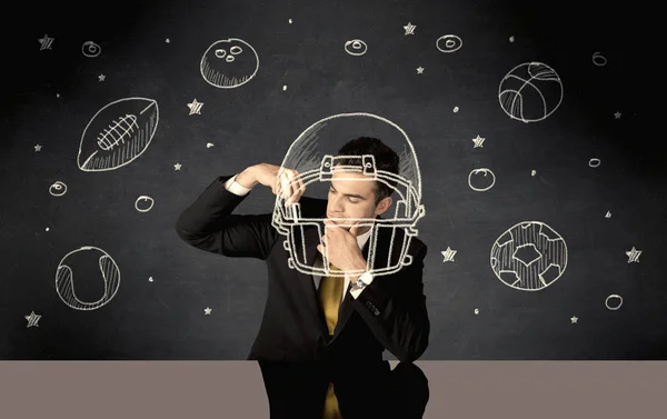 Affärsman rita hjälm och sport bollar — Stockfoto