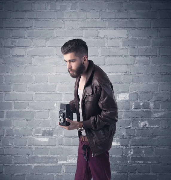 Fashion model in front of brick urban wall — Stock Photo, Image