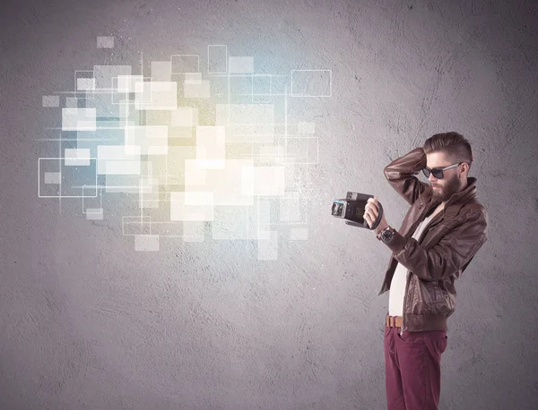 Hipster guy with retro camera in action — Stock Photo, Image