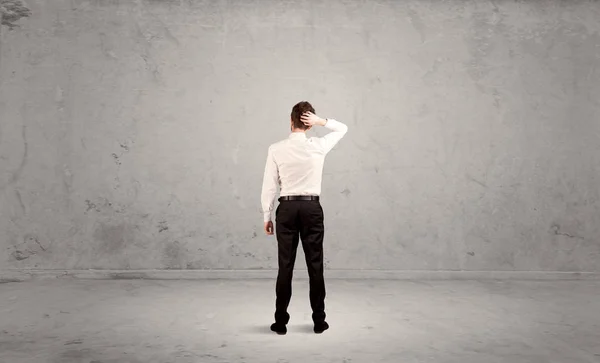 Businessman lost in empty urban space — Stock Photo, Image