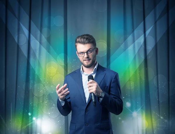 Businessman holding microphone — Stock Photo, Image