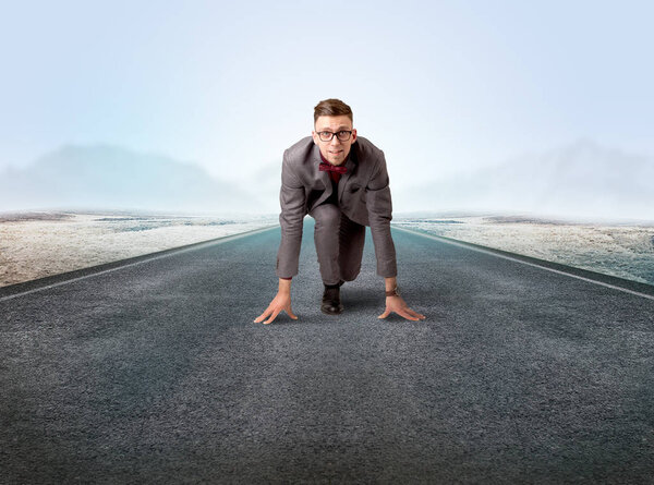 Businessman kneeling in ready position