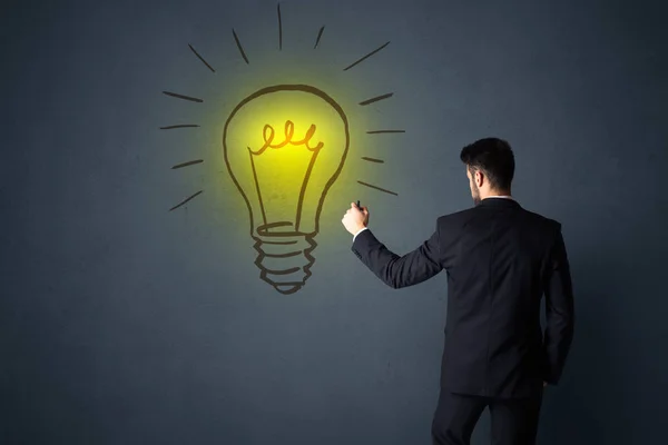 Businessman with lightbulb — Stock Photo, Image