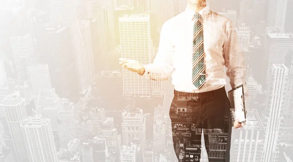 Business person with warm color overlay of city background — Stock Photo, Image