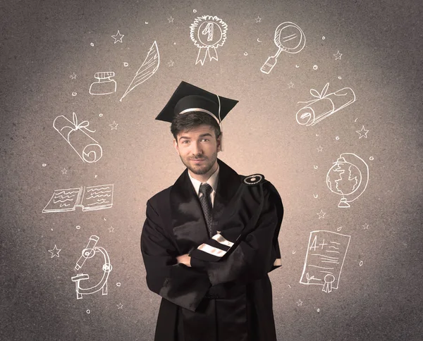 Heureux adolescent diplômé avec des icônes scolaires dessinées à la main — Photo