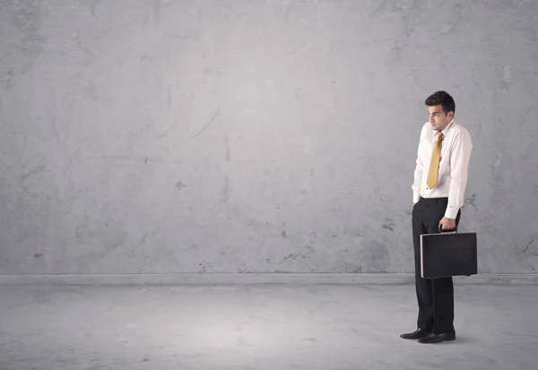 Young businessman standing confused — Stock Photo, Image