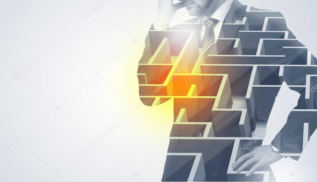 Businessman standing and thinking  with maze