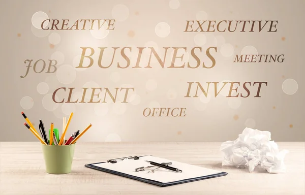 Business office desk with writing on wall — Stock Photo, Image