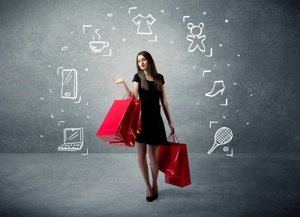 Shopping-Weibchen mit Taschen und gezeichneten Symbolen — Stockfoto