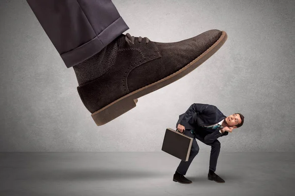 Employee afraid of the big boss foot — Stock Photo, Image