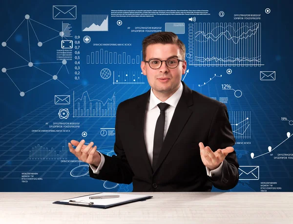 Businessman sitting at a desk — Stock Photo, Image