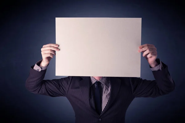 Businessman holding blank paper — Stock Photo, Image