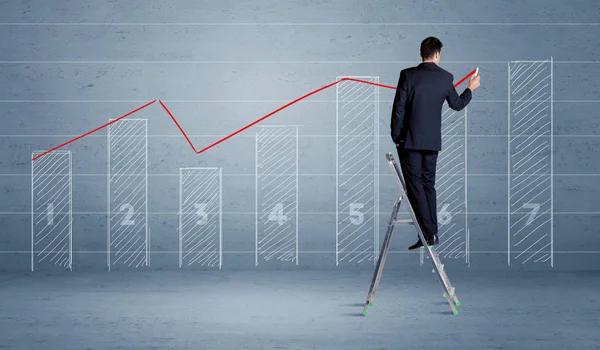 Man drawing chart from ladder — Stock Photo, Image