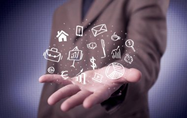 Avuçlarında çizim simgeleri olan bir ofis çalışanı