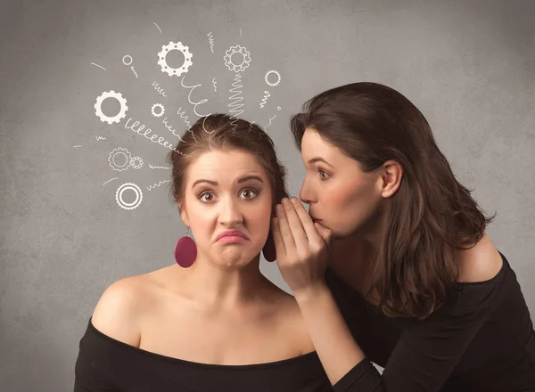 Girl telling secret things to her girlfriend — Stock Photo, Image