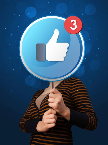 Woman holding facebook sign — Stock Photo, Image